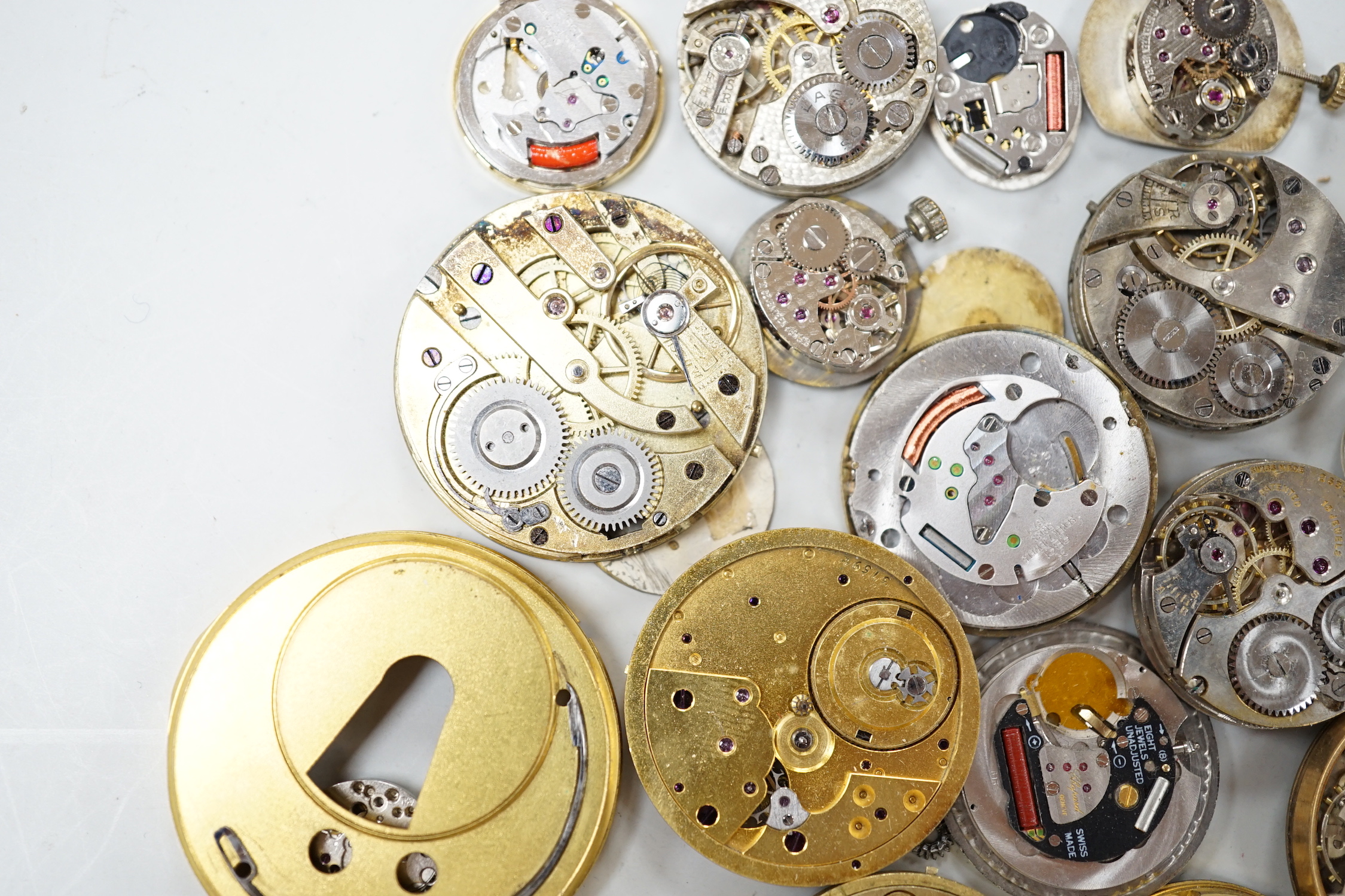 A quantity of assorted wrist and pocket watch parts and movements.